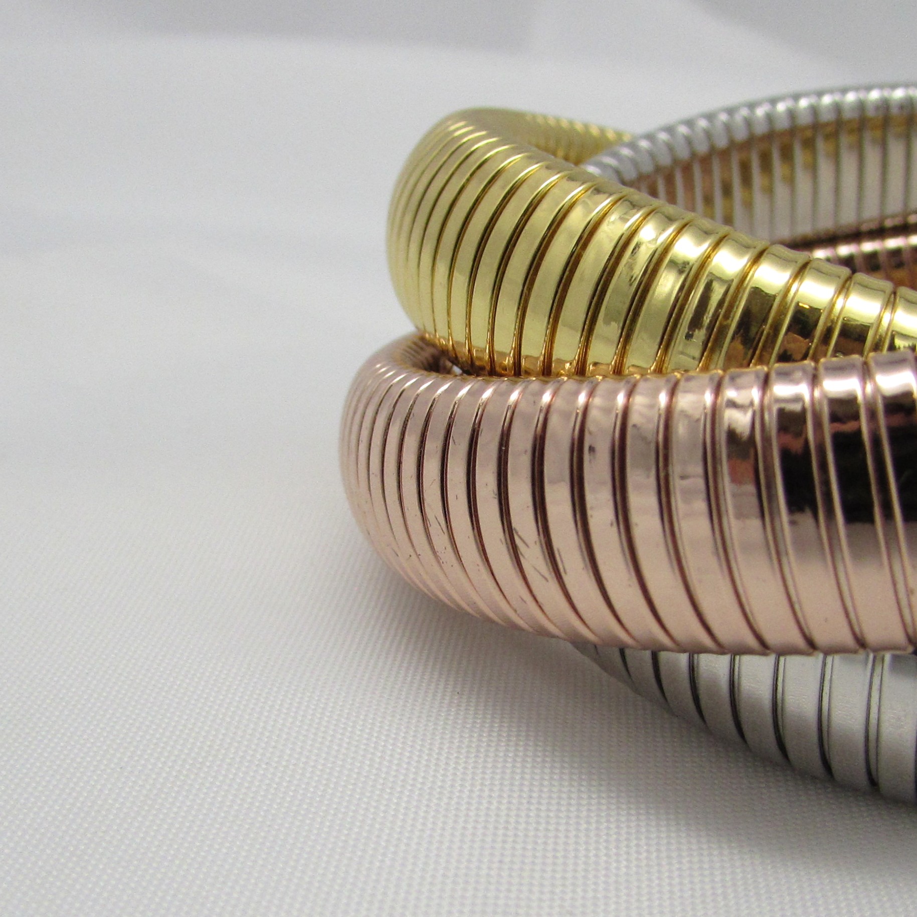 Gold, Silver & Rose Plated Triple Coil Bracelet - Image 3